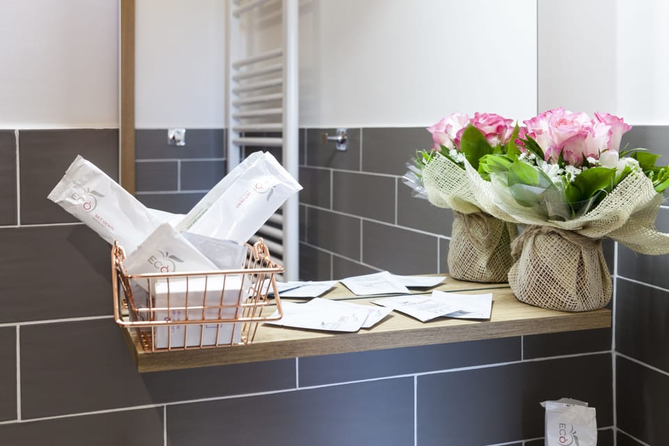 Shower, free toiletries, hair dryer, slippers