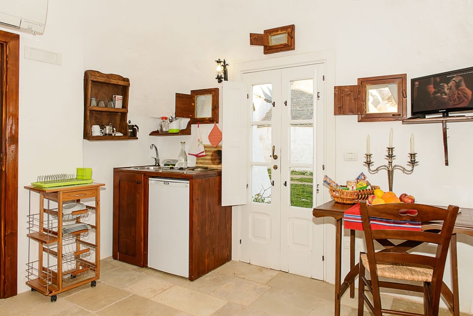 Apartment, 1 Bedroom, Garden View (Gelsomino) | Private kitchenette | Fridge, oven, stovetop, coffee/tea maker