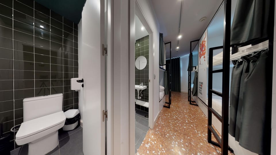 Shower, rainfall showerhead, hair dryer (on request), toilet paper