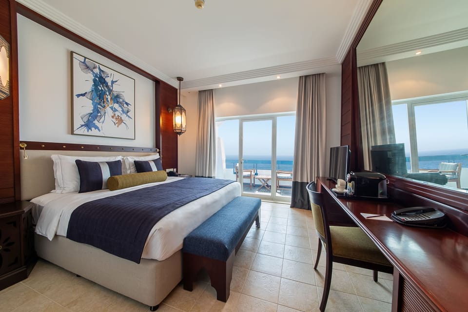 Deluxe Suite Sea View | Premium bedding, down comforters, minibar, in-room safe