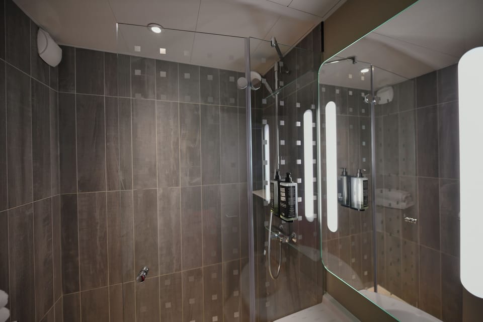 Shower, eco-friendly toiletries, hair dryer, towels