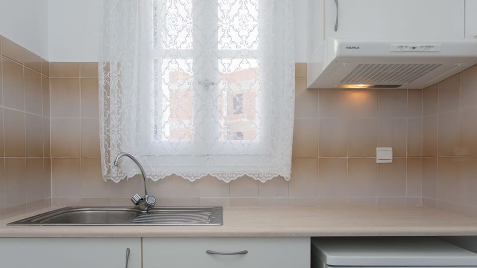 Fridge, electric kettle, cookware/dishes/utensils