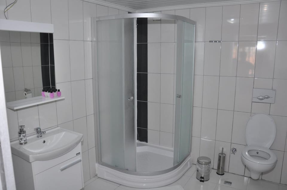 Shower, free toiletries, hair dryer, slippers