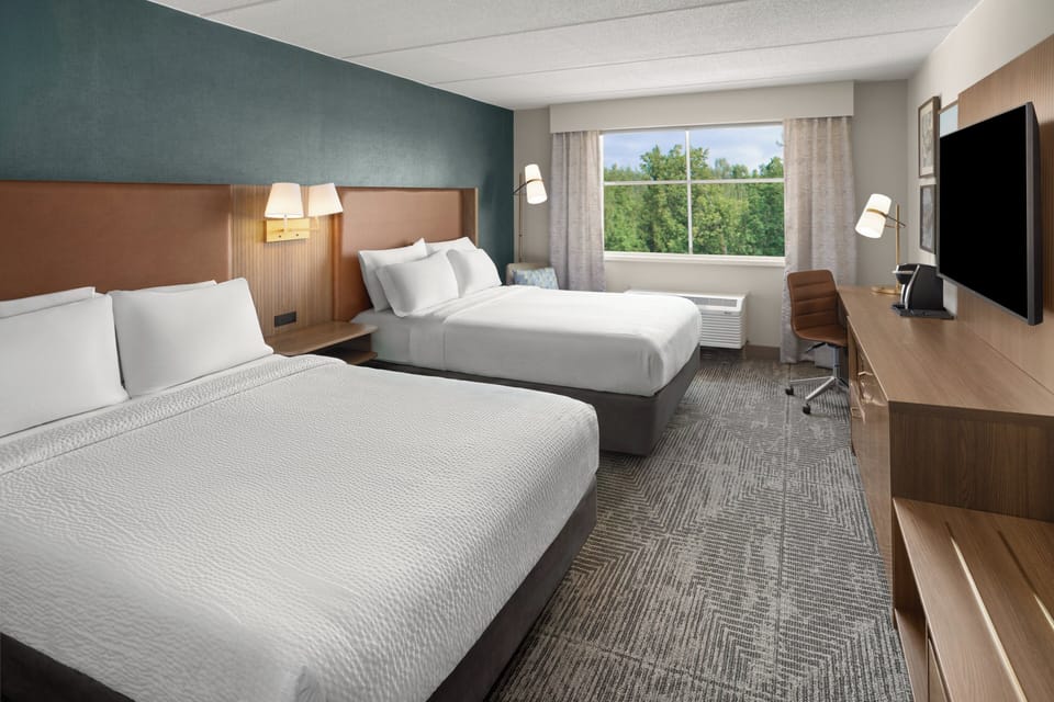 Premium bedding, pillowtop beds, desk, blackout drapes