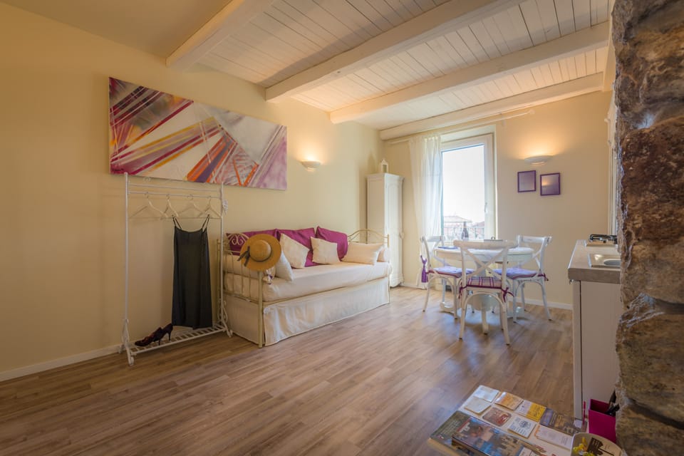 Deluxe Apartment, City View | Living area | Flat-screen TV