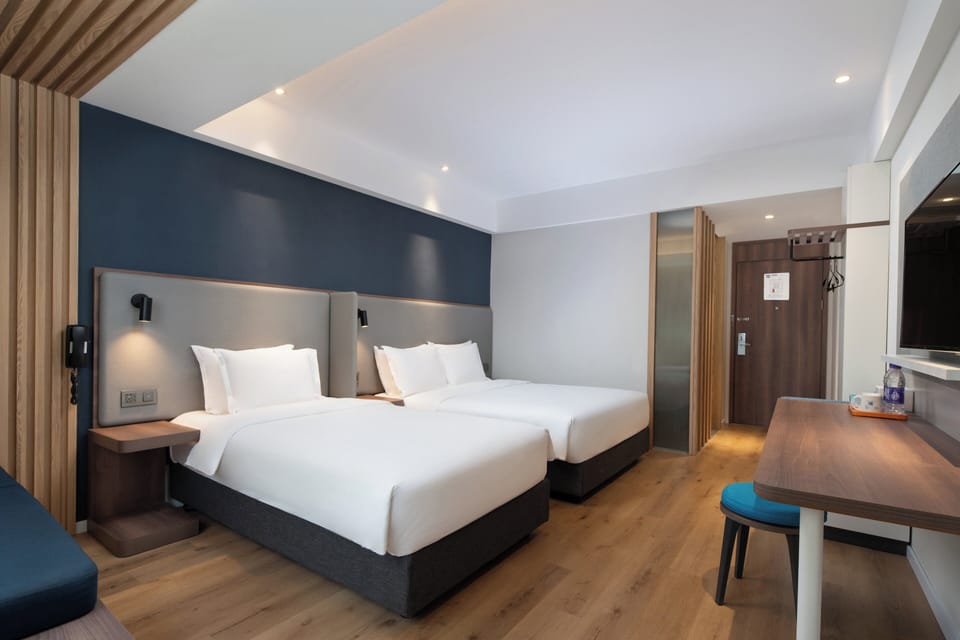 Standard Room, Multiple Beds | Minibar, in-room safe, desk, blackout drapes