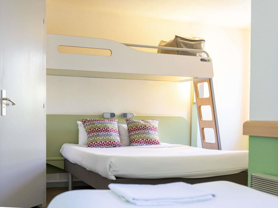 Family Room | Premium bedding, desk, laptop workspace, blackout drapes