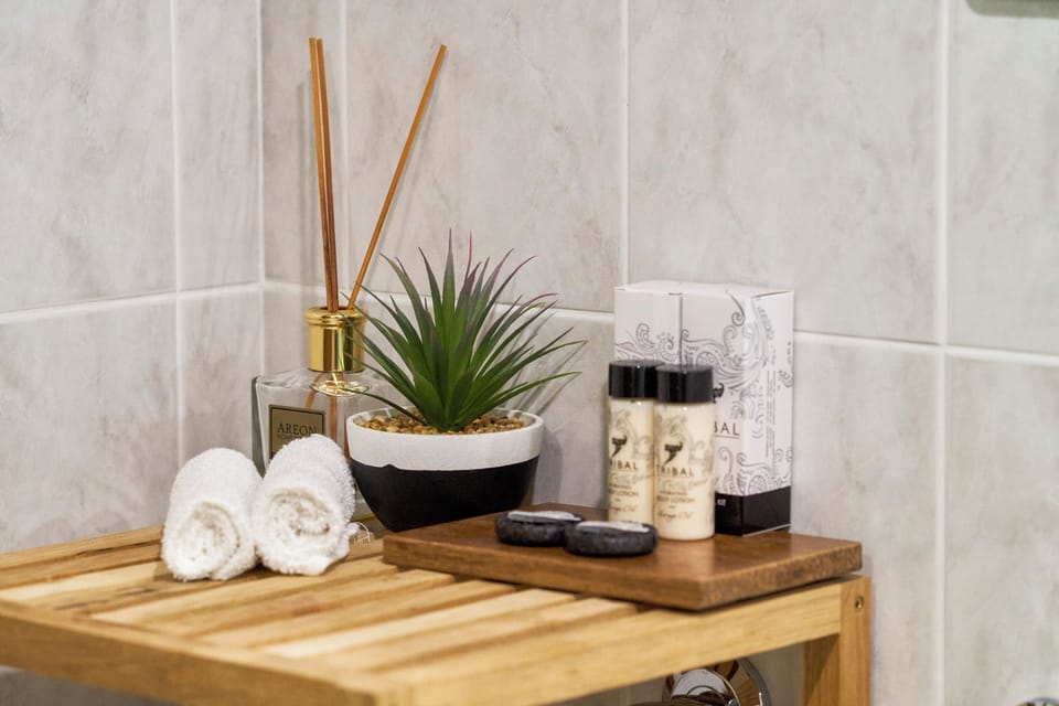 Designer toiletries, hair dryer, bathrobes, slippers