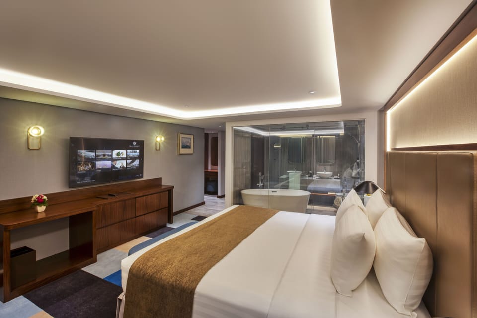 Suite, 1 King Bed (Duplex) | Hypo-allergenic bedding, in-room safe, desk, laptop workspace