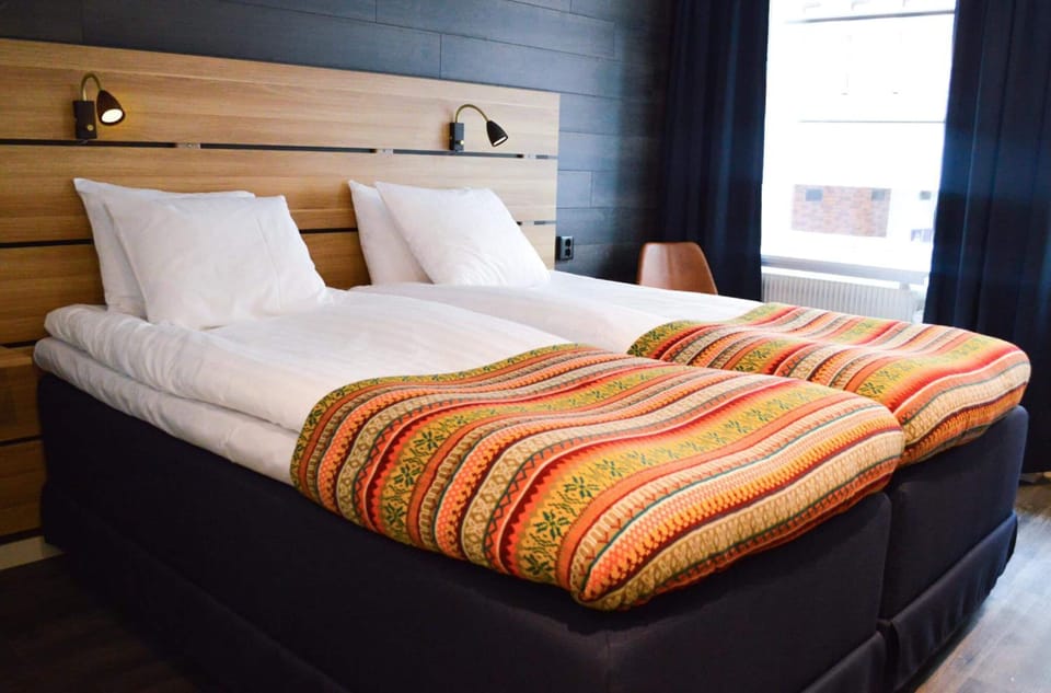Premium bedding, desk, blackout drapes, iron/ironing board (on request)