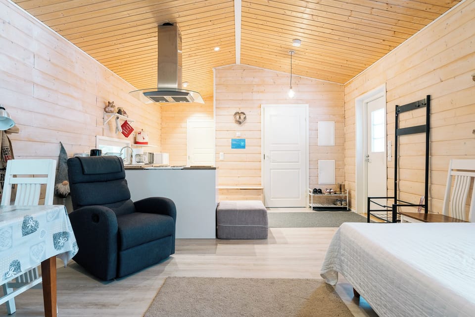 Deluxe Villa | Living area | 50-inch flat-screen TV with cable channels, heated floors