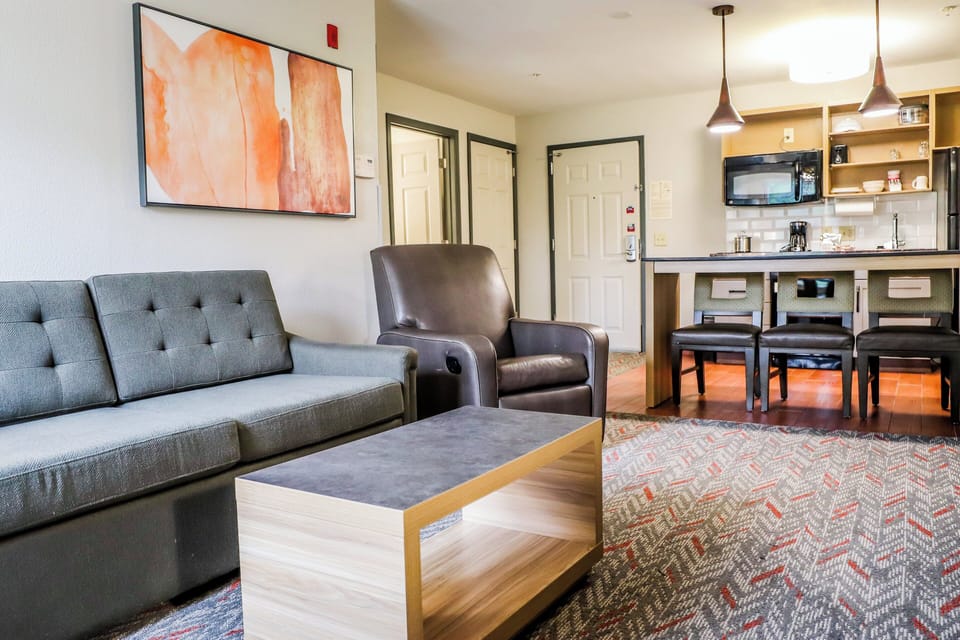 Suite, 1 Bedroom | Desk, blackout drapes, iron/ironing board, free WiFi