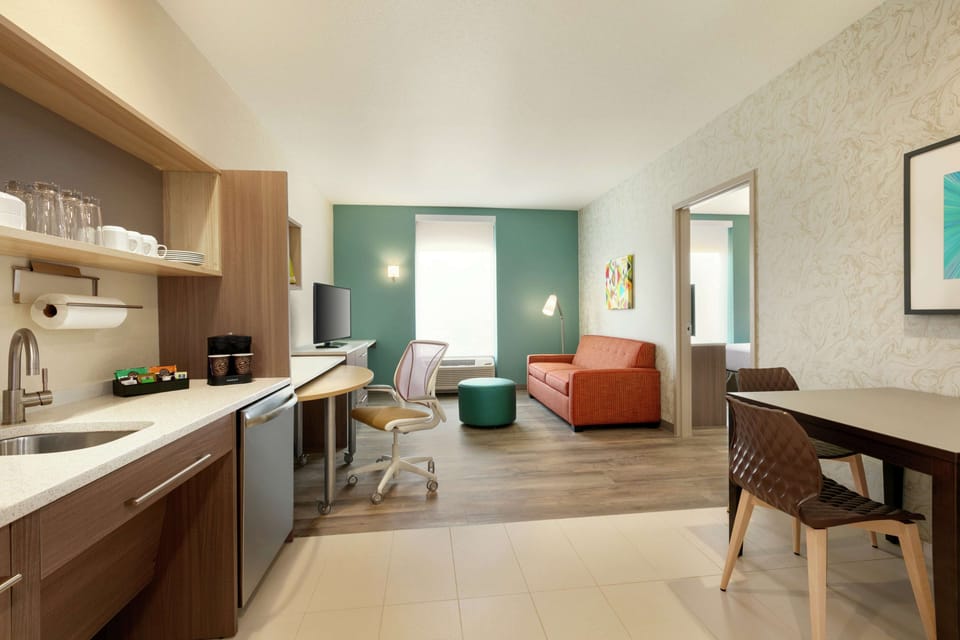 Premium bedding, desk, laptop workspace, blackout drapes