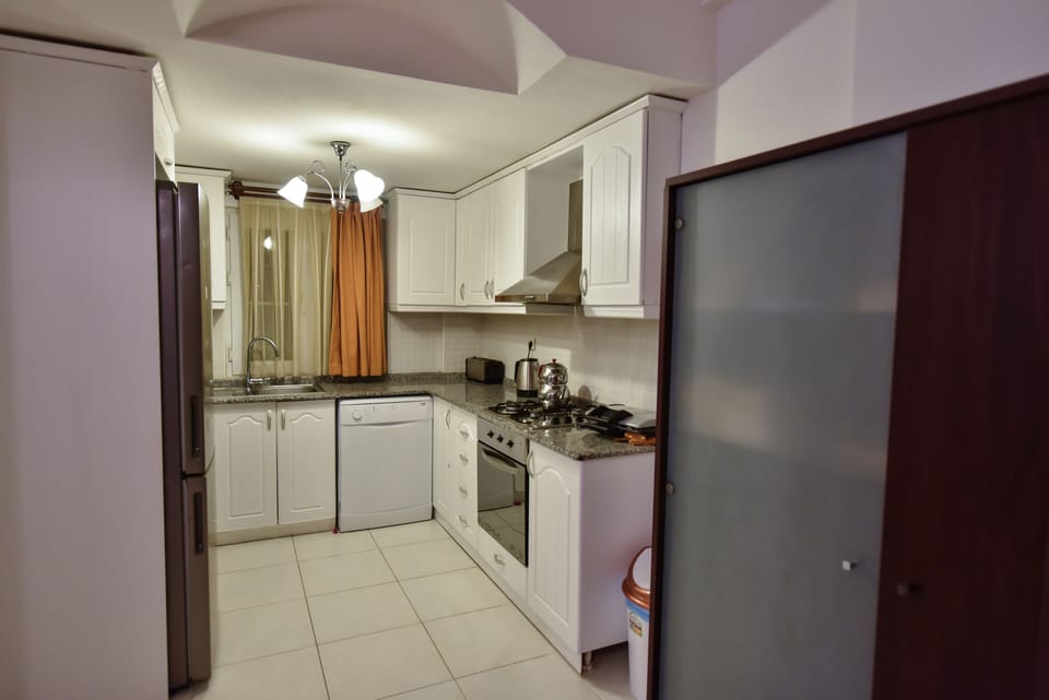 Villa, 4 Bedrooms | Private kitchen | Coffee/tea maker, full-size fridge, microwave, oven
