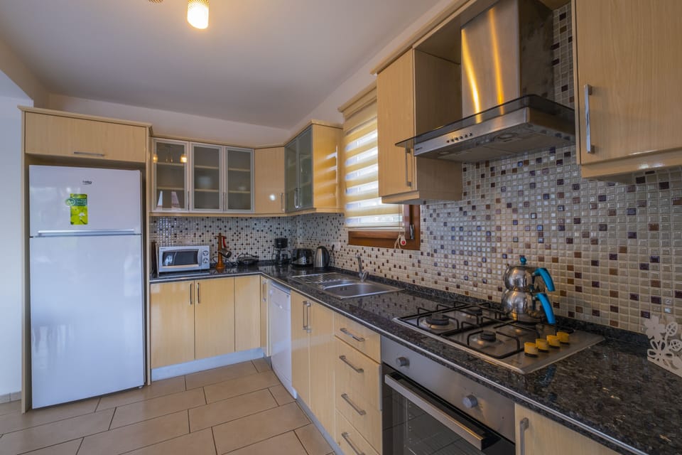 Villa, 4 Bedrooms (Opal 5) | Private kitchen | Full-size fridge, microwave, oven, stovetop