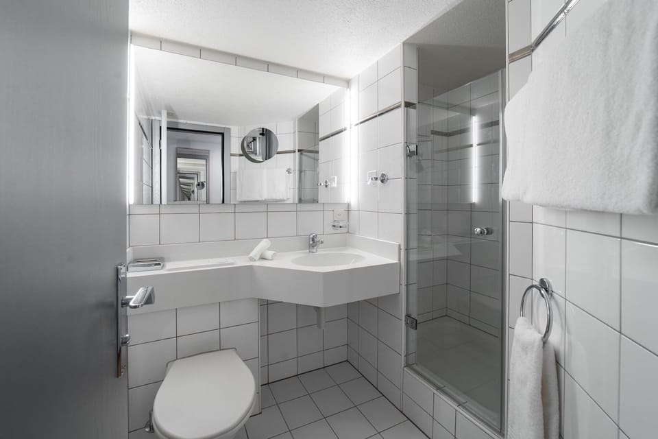 Combined shower/tub, deep soaking tub, hair dryer, bathrobes