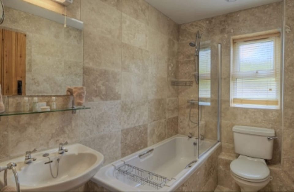 Designer toiletries, hair dryer, bathrobes, slippers