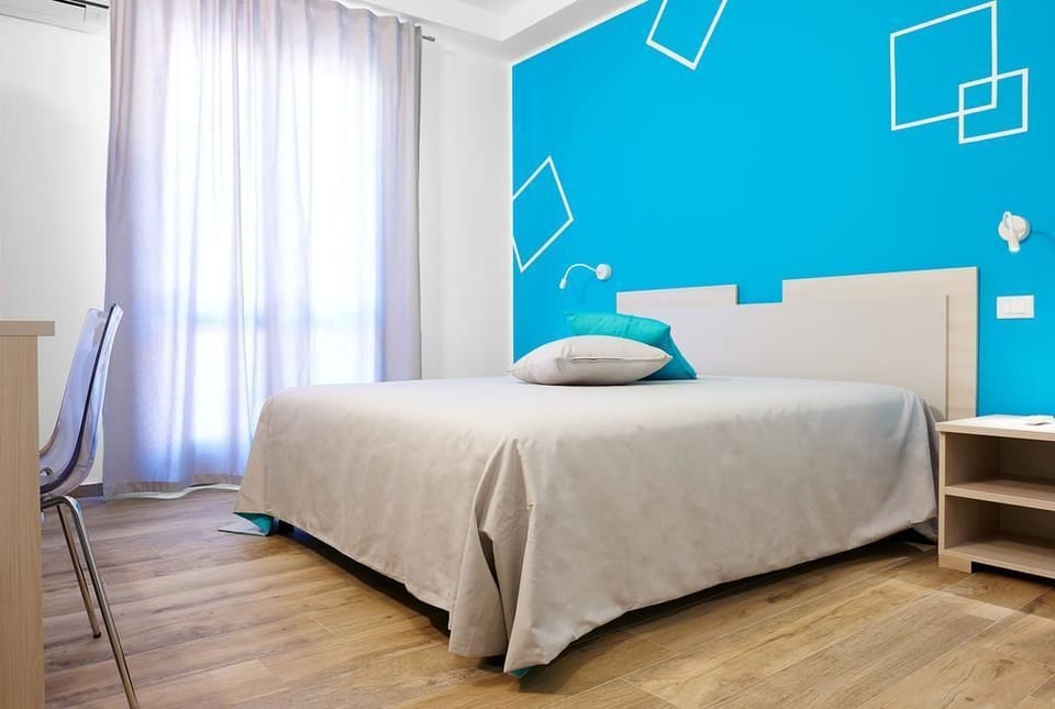 Triple Room, Balcony | Down comforters, desk, iron/ironing board, free WiFi