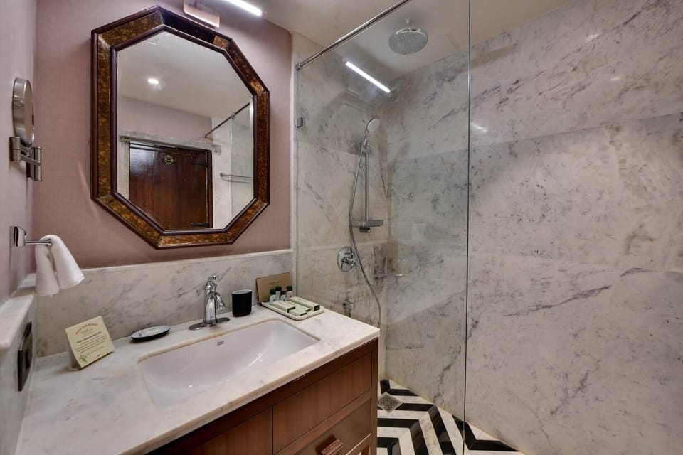 Winter Green Premium Room | Bathroom | Separate tub and shower, rainfall showerhead, designer toiletries