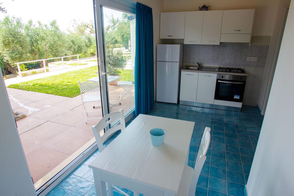 Apartment, Garden View | Living area | 22-inch LED TV with digital channels