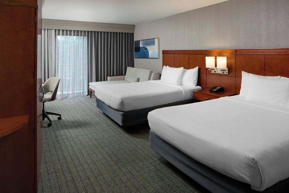 Hypo-allergenic bedding, pillowtop beds, in-room safe, desk