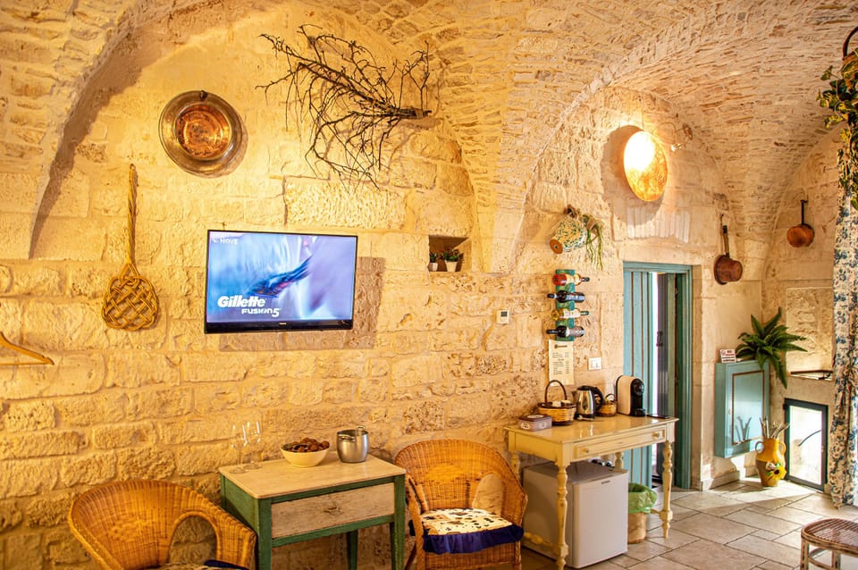 Exclusive Suite, 1 Bedroom, Private Bathroom | Living area | 32-inch flat-screen TV with satellite channels, TV