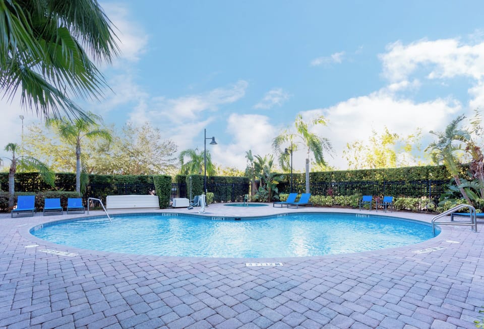 Outdoor pool, open 7:00 AM to 11:00 PM, sun loungers