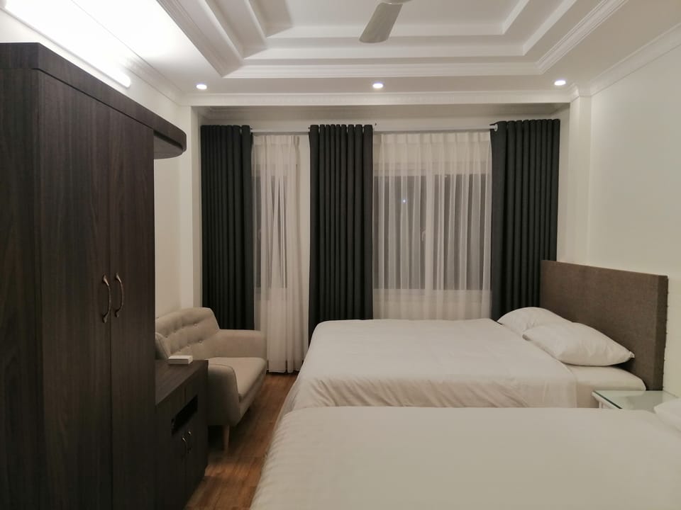 Family Quadruple Room, Non Smoking | Minibar, desk, soundproofing, iron/ironing board