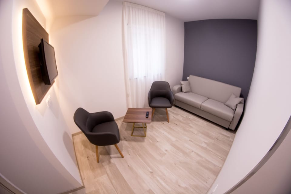 Junior Suite, 1 King Bed with Sofa bed, Non Smoking, Balcony | Living area | Flat-screen TV