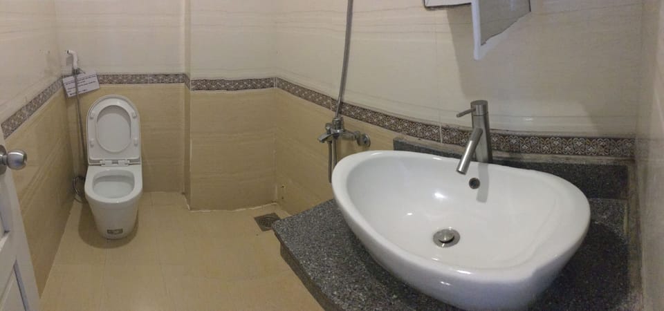 Shower, free toiletries, hair dryer, slippers