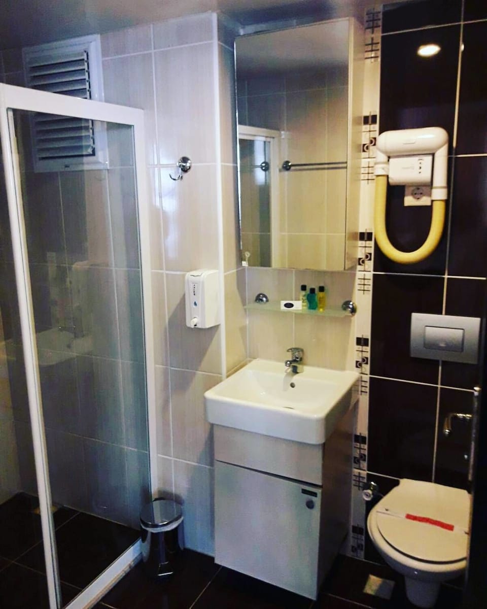 Shower, free toiletries, hair dryer, slippers