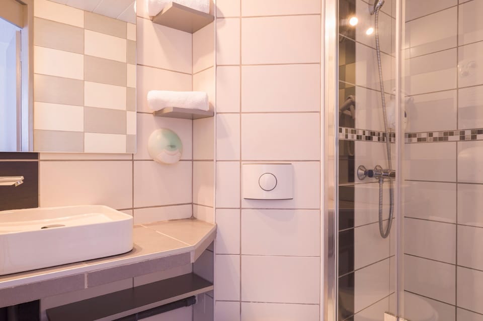 Shower, free toiletries, hair dryer, towels