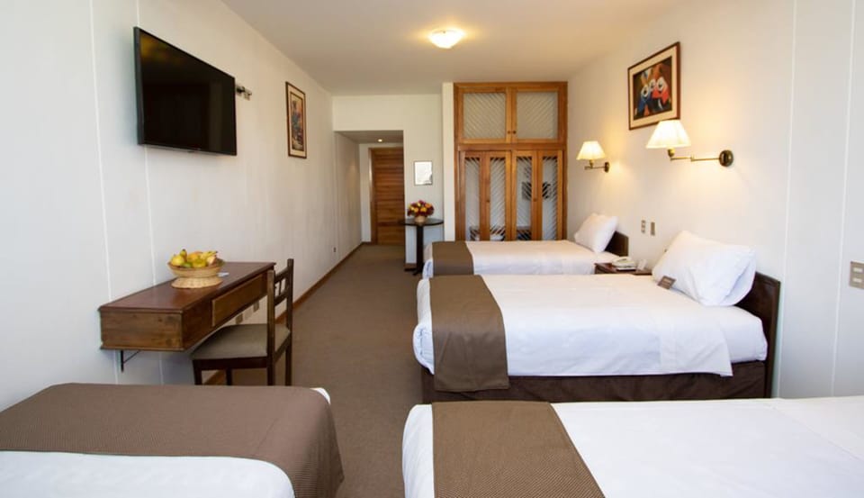 Basic Quadruple Room | Minibar, in-room safe, desk, WiFi (free)