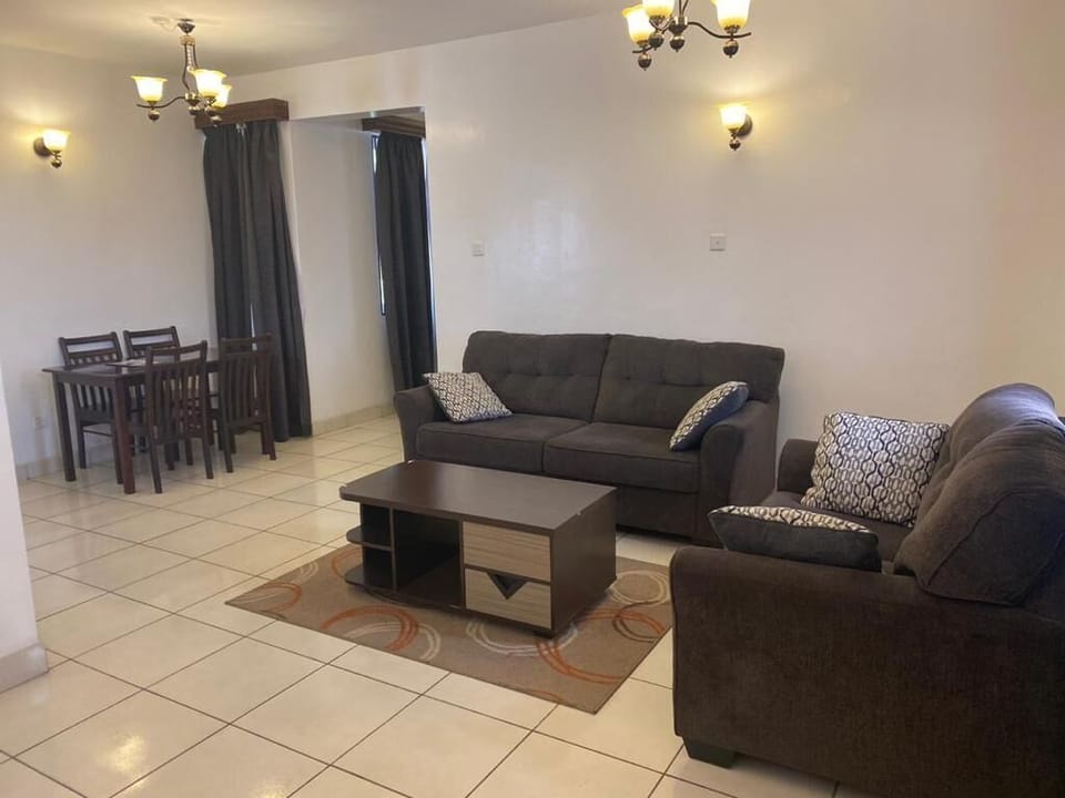 Executive Apartment | Living area | TV