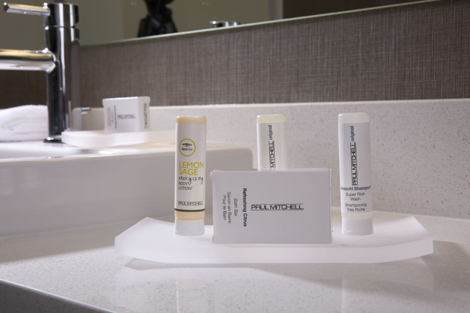 Combined shower/tub, designer toiletries, hair dryer, towels