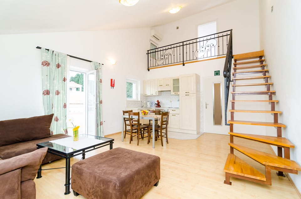 City Apartment, 1 Bedroom, Balcony (A2) | Living area | 82-cm flat-screen TV with satellite channels, TV