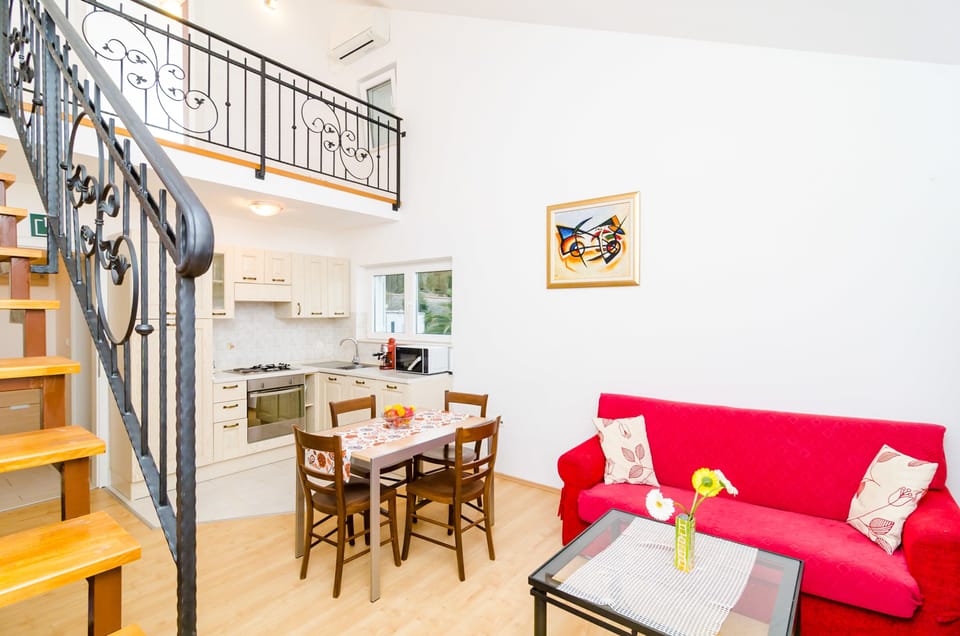 City Apartment, 1 Bedroom, Balcony (A1) | Living area | 82-cm flat-screen TV with satellite channels, TV