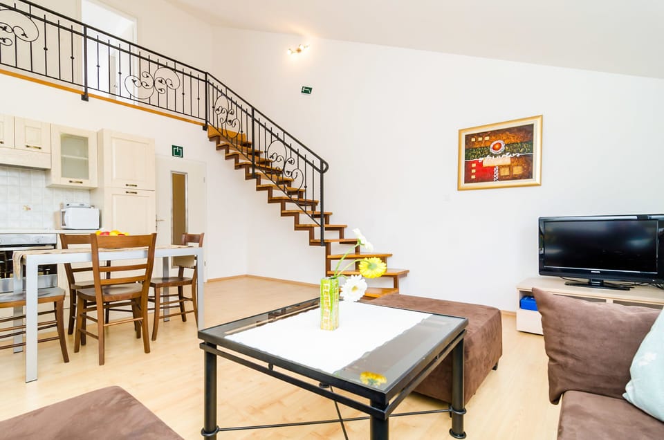City Apartment, 1 Bedroom, Balcony (A2) | Living area | 82-cm flat-screen TV with satellite channels, TV