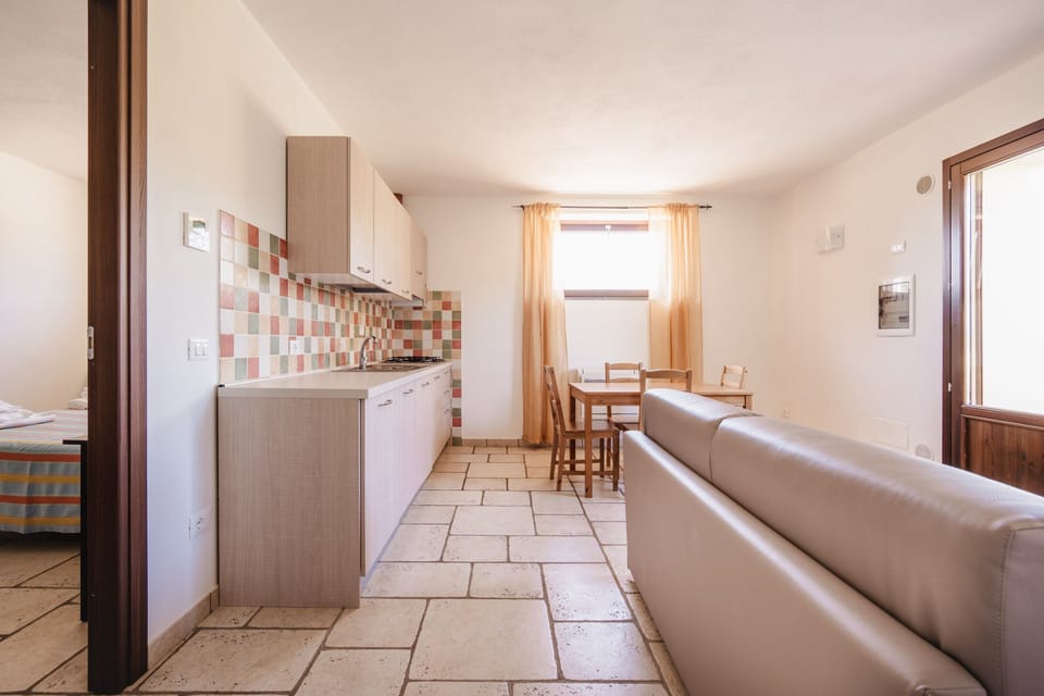 Standard Apartment, 1 Bedroom | Living area | TV