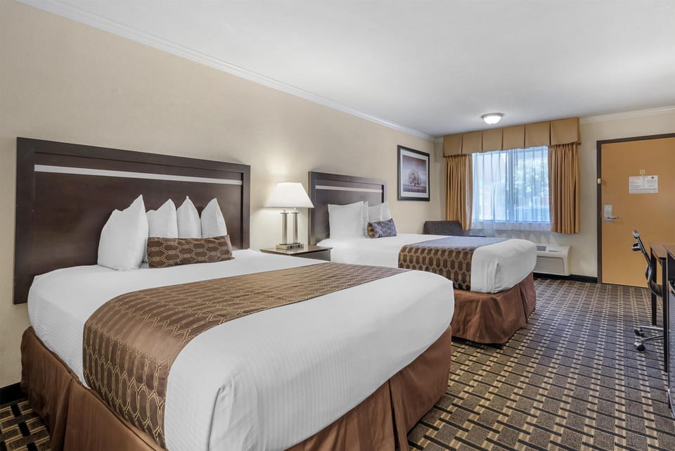 Standard Room, 2 Queen Beds, Non Smoking, Jetted Tub | Desk, laptop workspace, iron/ironing board, free internet