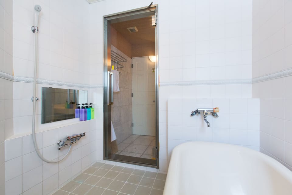 Twin or King Room | Bathroom | Hair dryer (on request), towels, soap, shampoo
