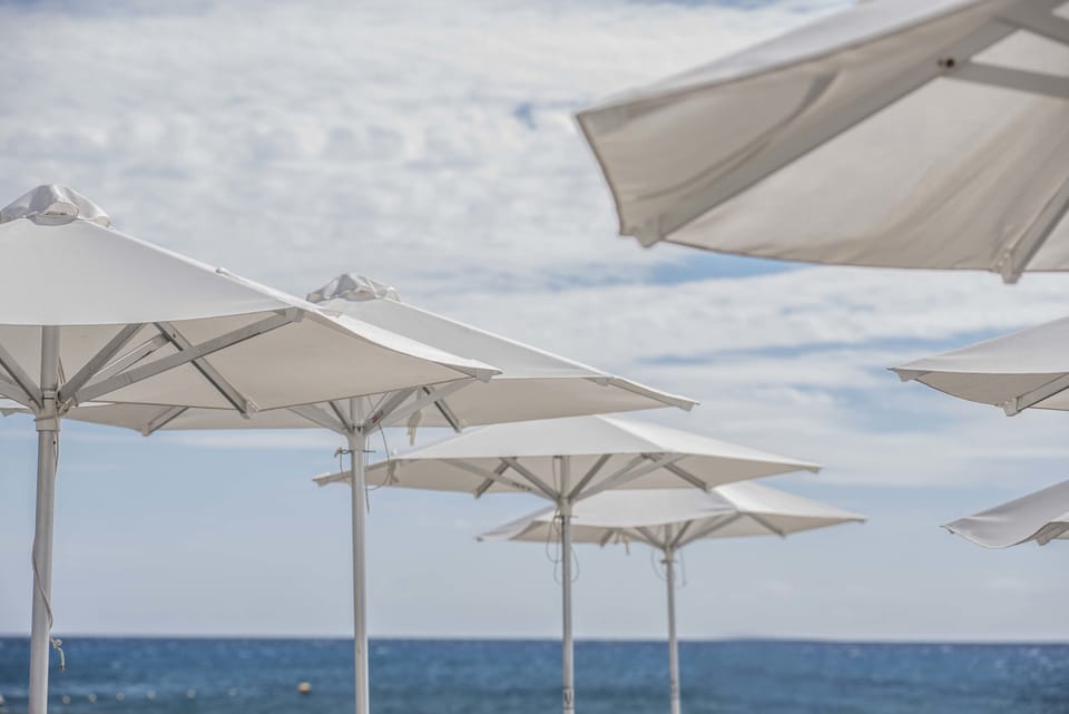 On the beach, beach cabanas, sun loungers, beach umbrellas