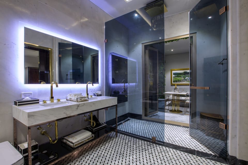 Portrait Suite Interior | Bathroom | Designer toiletries, hair dryer, bathrobes, slippers
