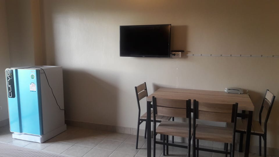 Deluxe Double Room, Balcony | Living area | TV