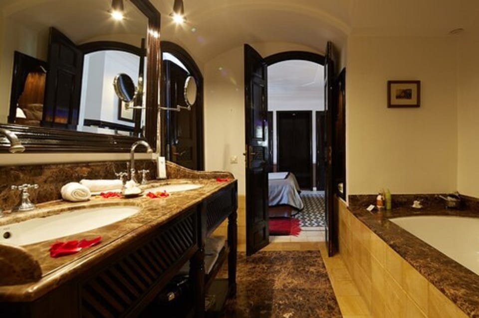 Shower, designer toiletries, hair dryer, bathrobes