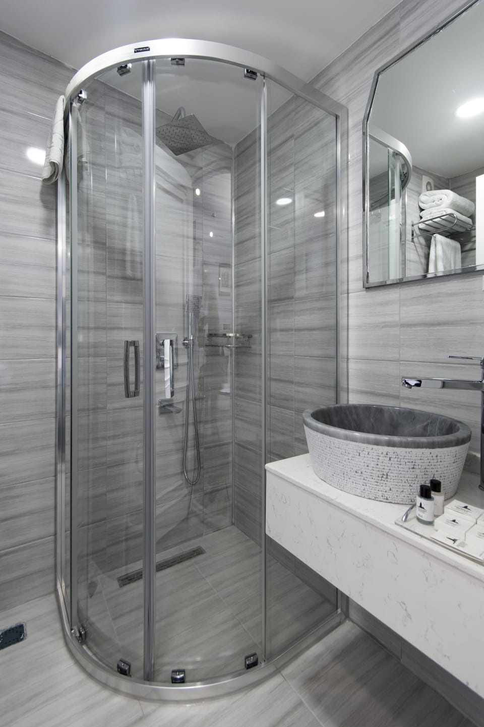 Shower, rainfall showerhead, designer toiletries, hair dryer