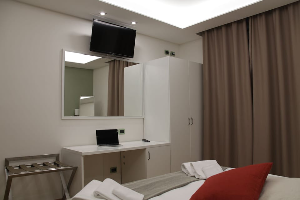 Double or Twin Room | Minibar, in-room safe, desk, rollaway beds