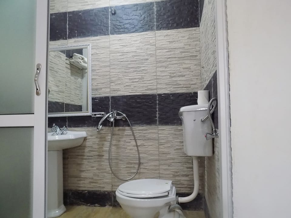 Shower, free toiletries, slippers, towels