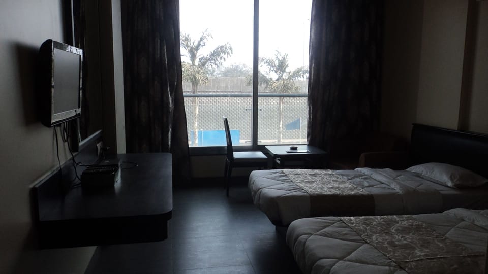 Premium bedding, desk, laptop workspace, iron/ironing board (on request)