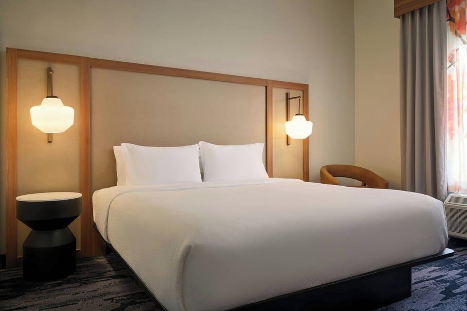 Premium bedding, Tempur-Pedic beds, desk, blackout drapes